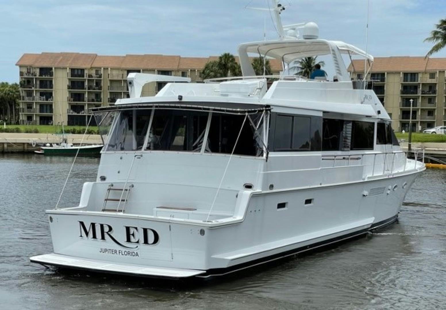 a white boat on the water aboard MR. ED Yacht for Sale