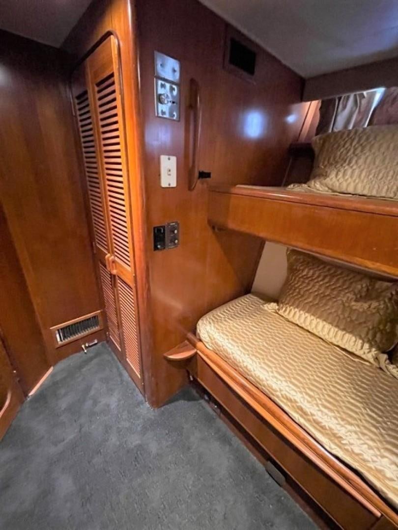 a room with bunk beds aboard MR. ED Yacht for Sale