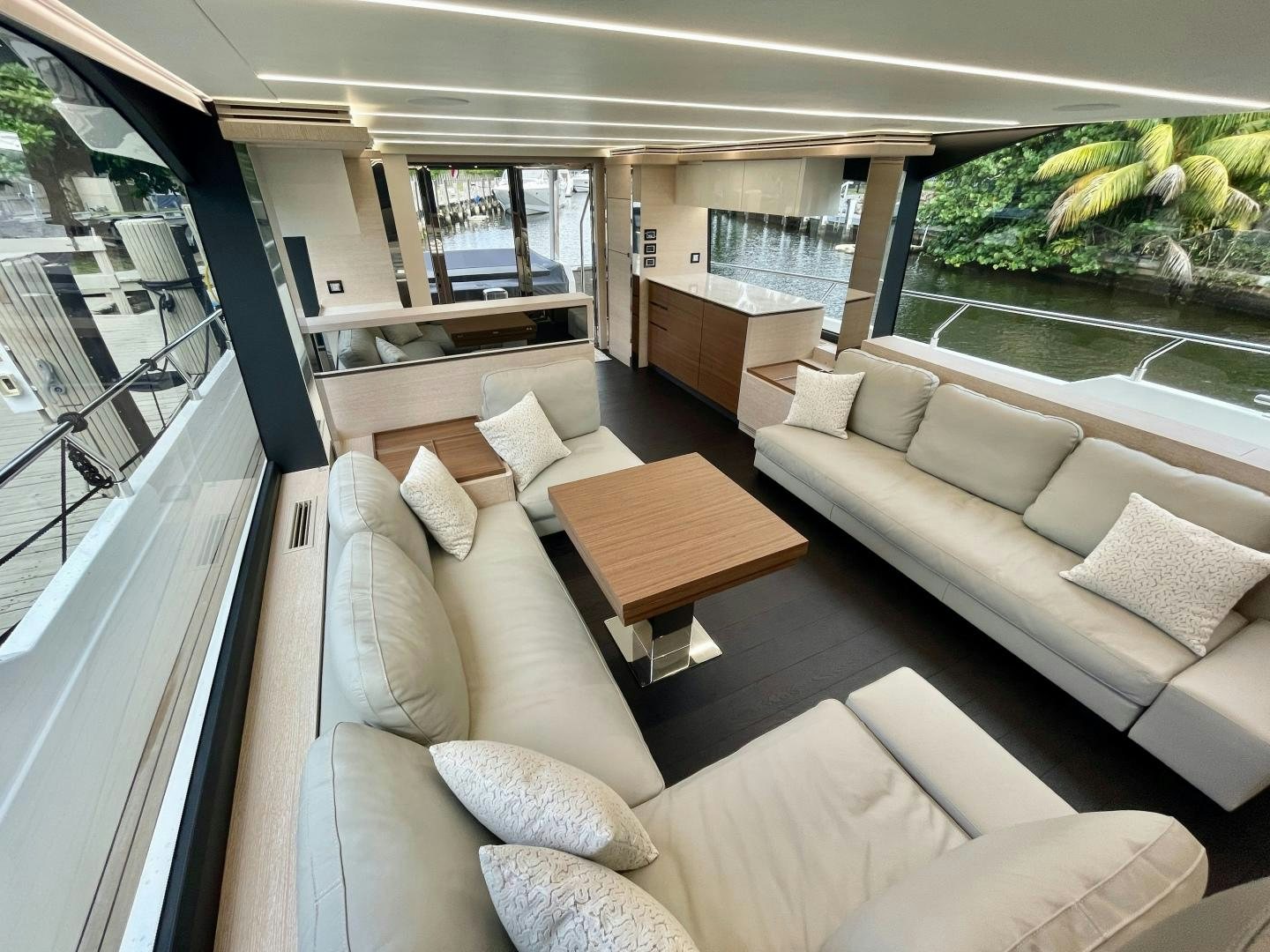 a living room with a couch and a table aboard AGRODOLCE Yacht for Sale