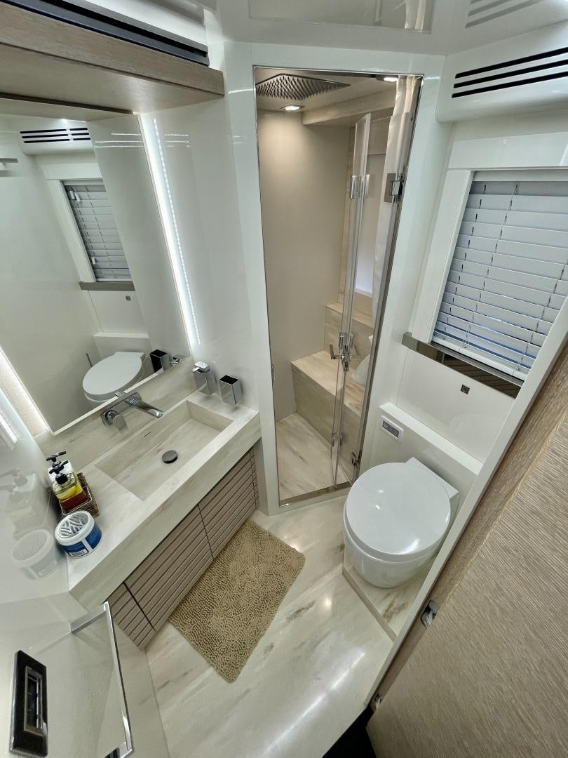 a bathroom with a toilet and a sink aboard AGRODOLCE Yacht for Sale