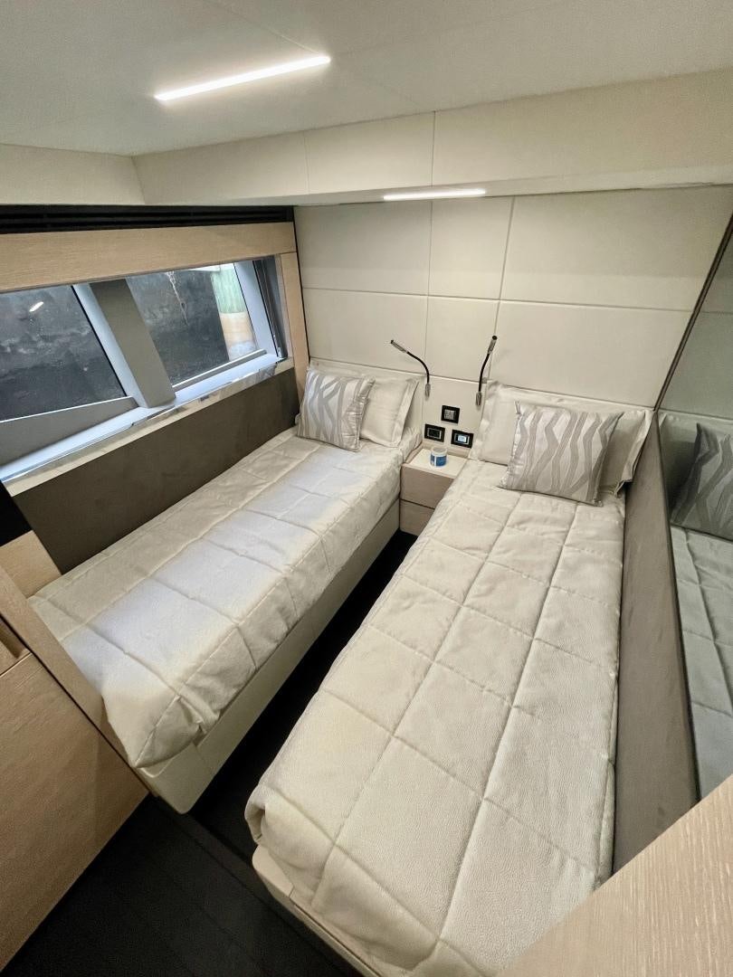 a bed in a room aboard AGRODOLCE Yacht for Sale