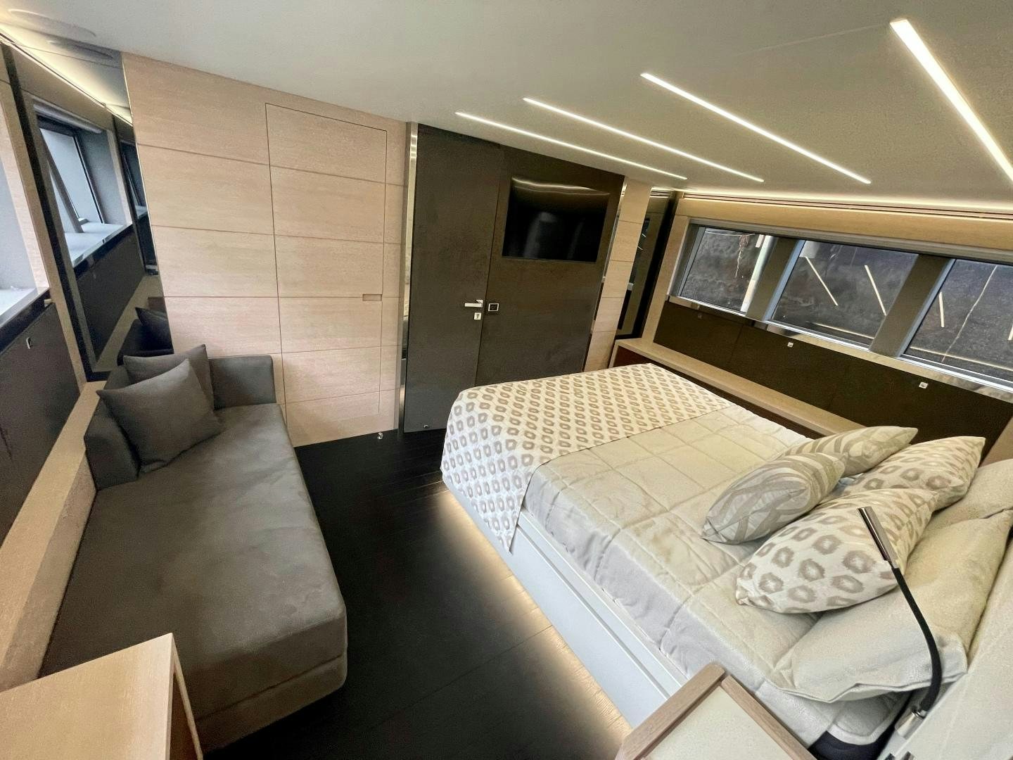 a room with a bed and a couch aboard AGRODOLCE Yacht for Sale