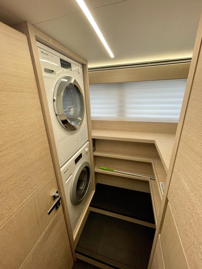 a washer and dryer in a room aboard AGRODOLCE Yacht for Sale