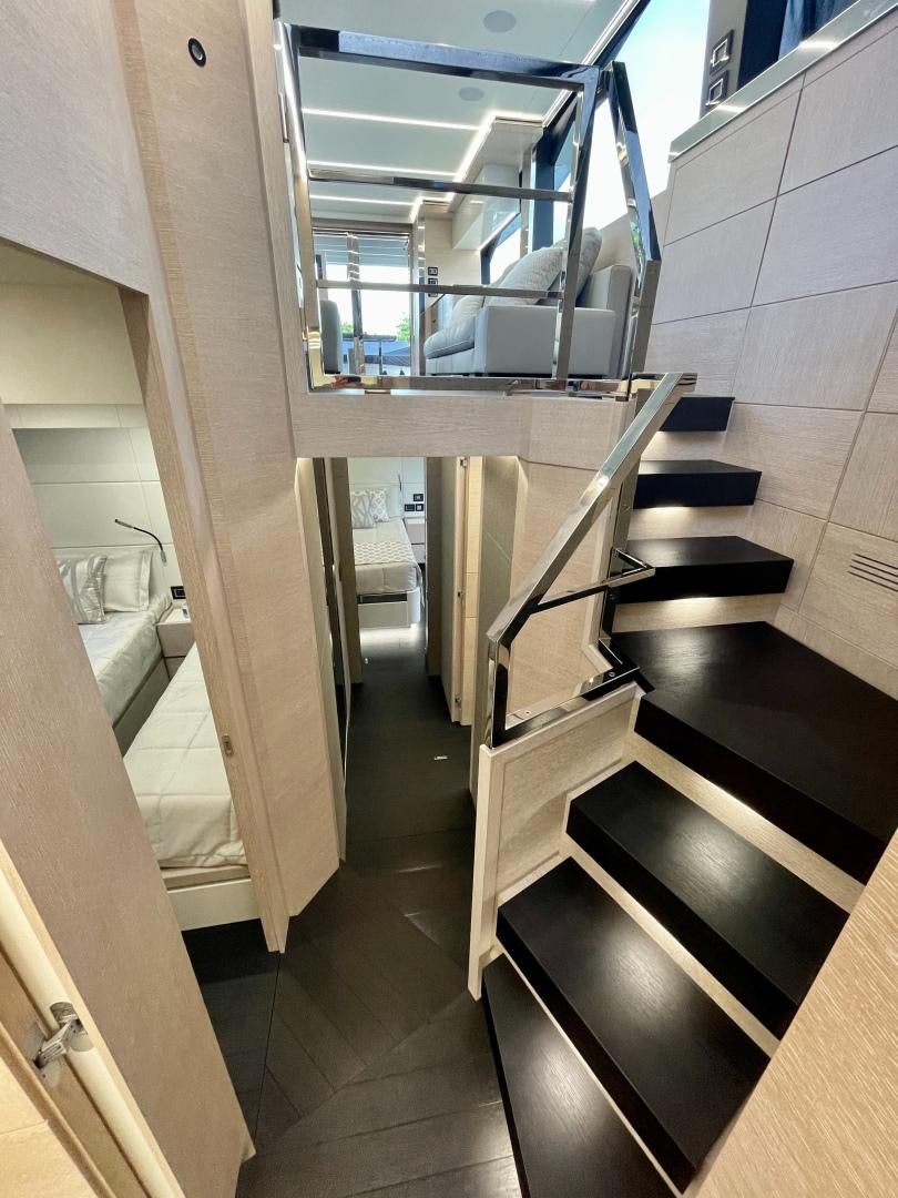 a hallway with a glass door aboard AGRODOLCE Yacht for Sale