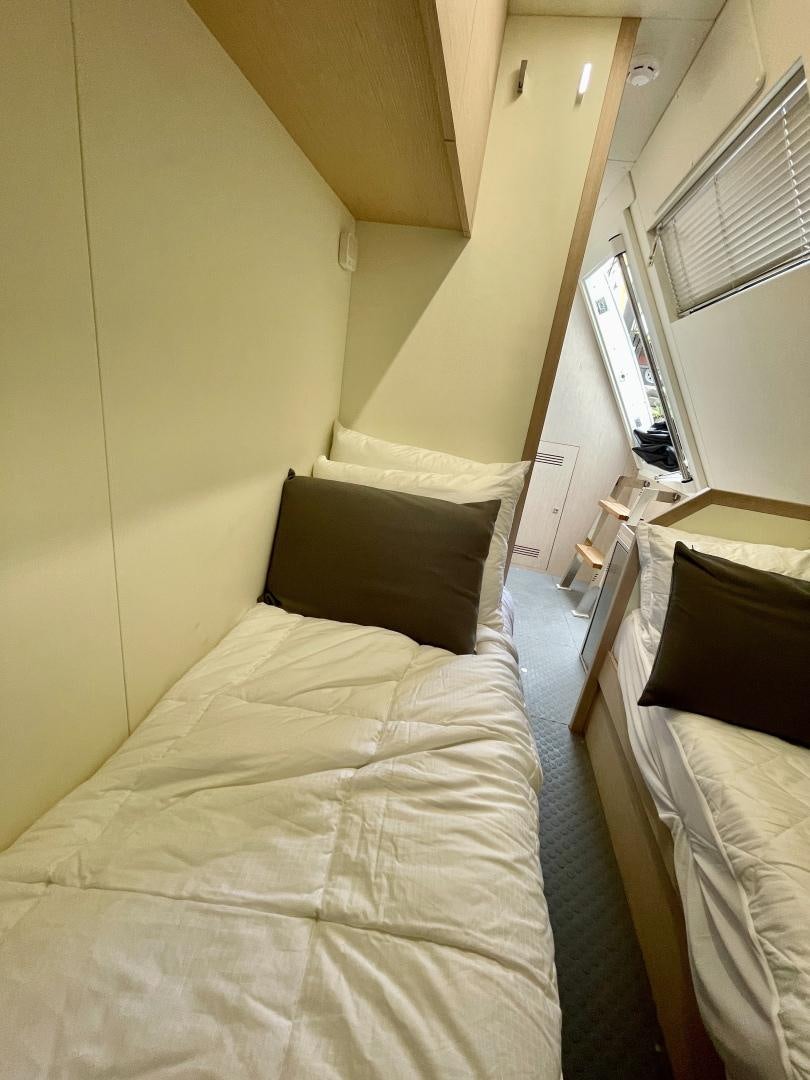 a bed in a room aboard AGRODOLCE Yacht for Sale