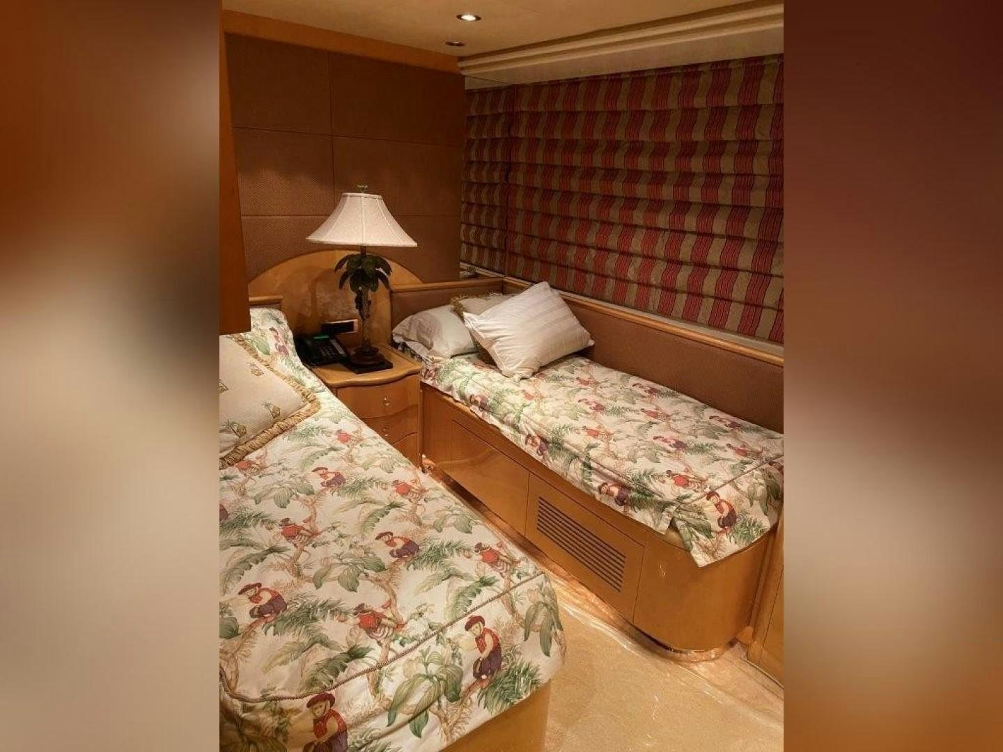 a couple of beds sit near each other aboard ISLAND SEEKER Yacht for Sale