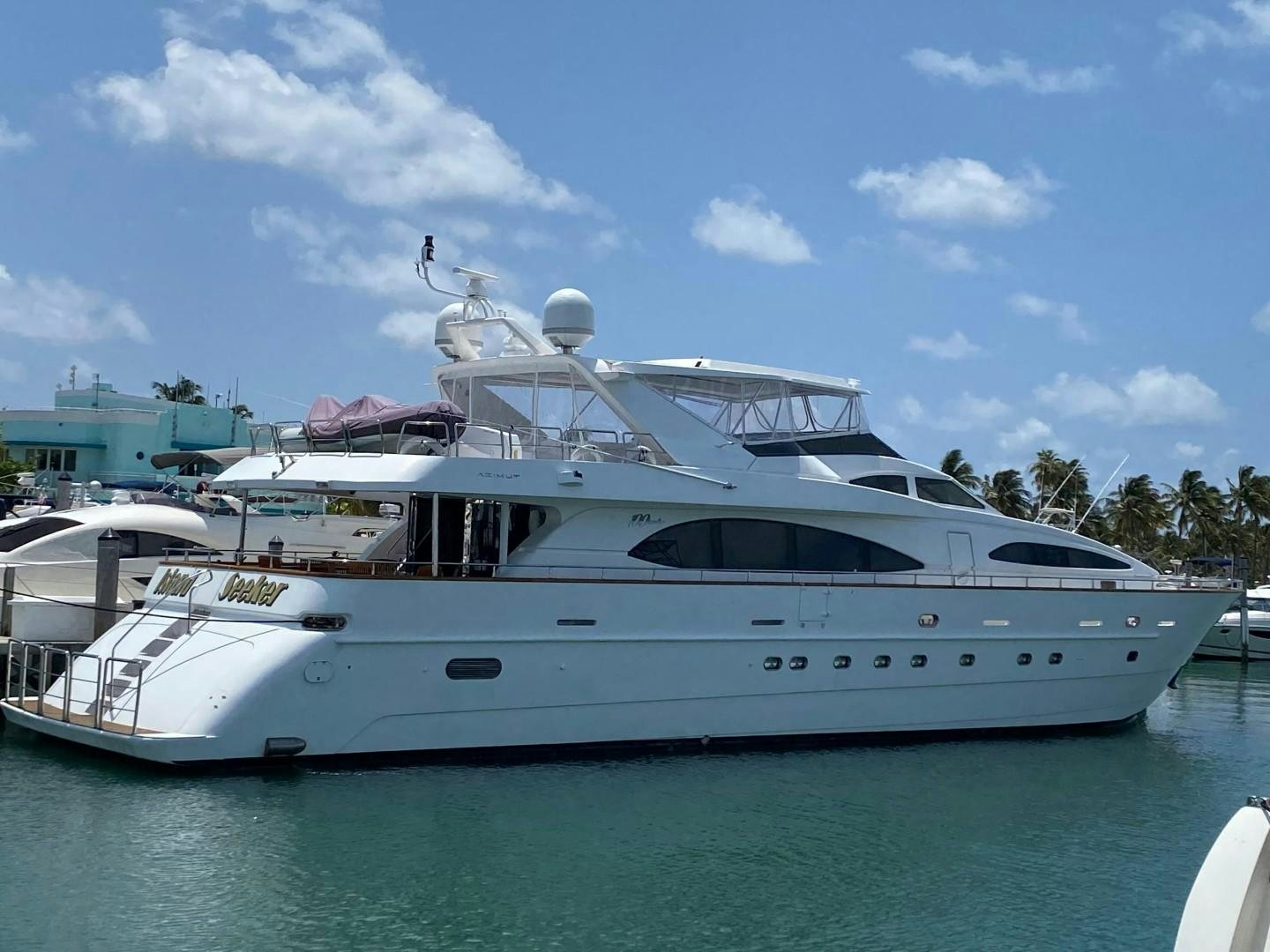 a white yacht in the water aboard ISLAND SEEKER Yacht for Sale