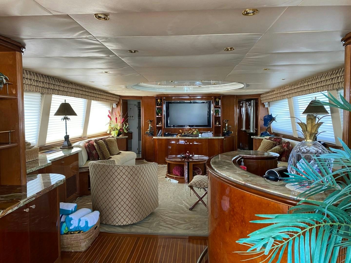 a living room with a television and a table aboard ISLAND SEEKER Yacht for Sale