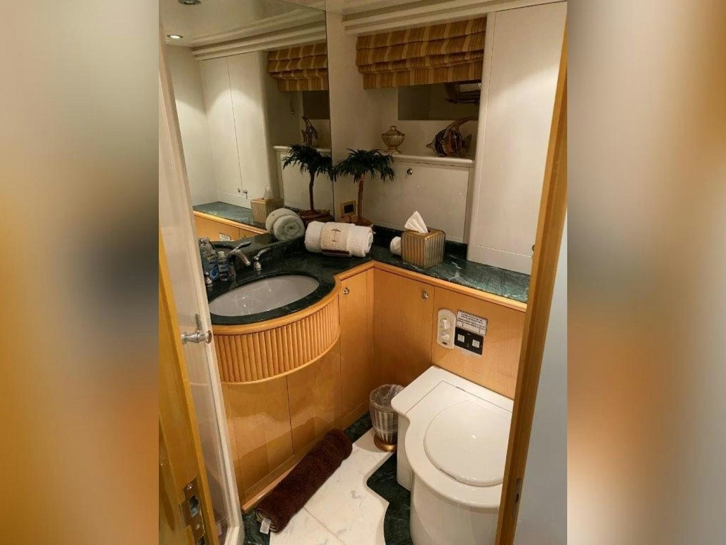 a bathroom with a sink and toilet aboard ISLAND SEEKER Yacht for Sale