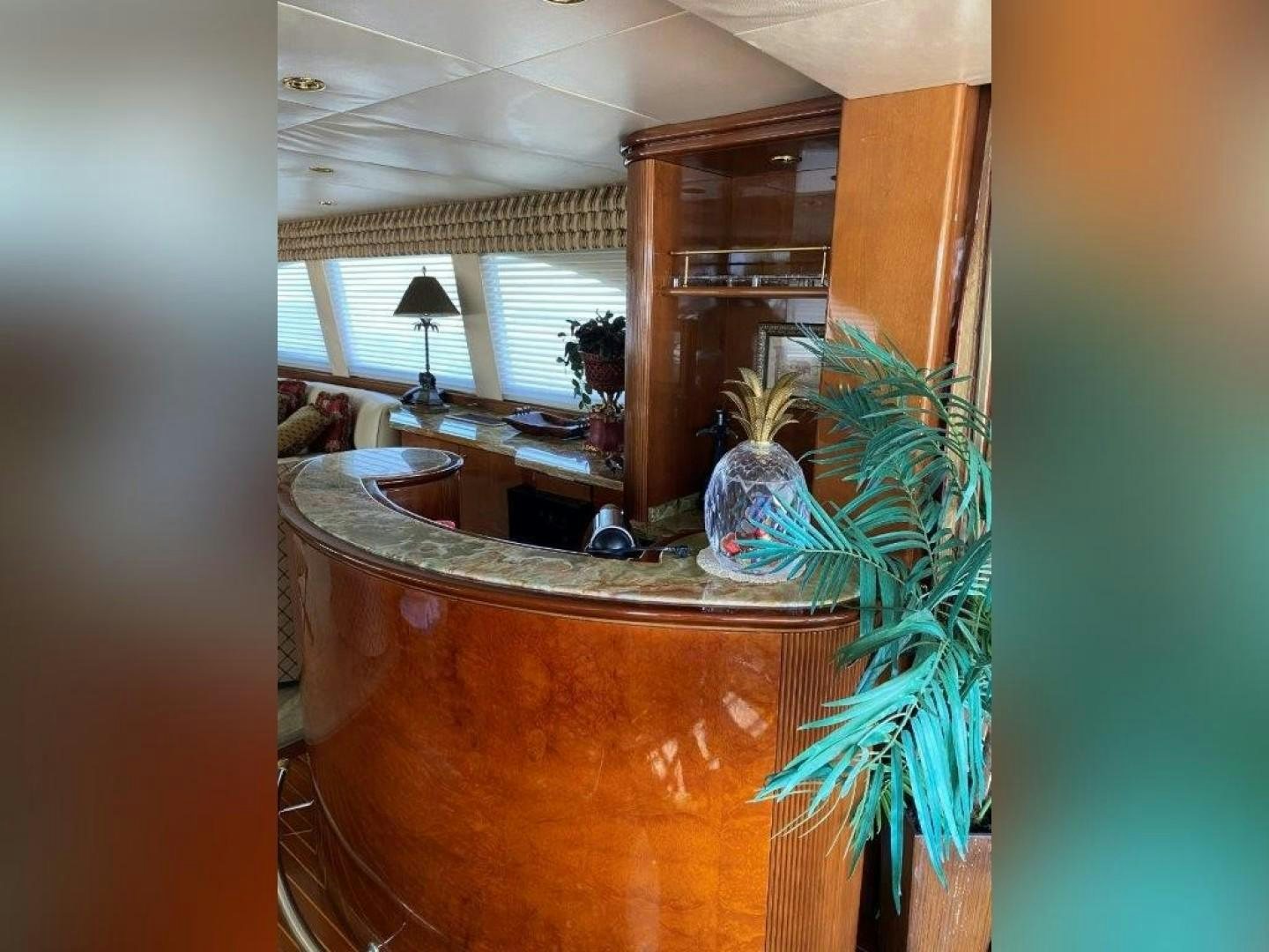 a room with a plant and a table aboard ISLAND SEEKER Yacht for Sale
