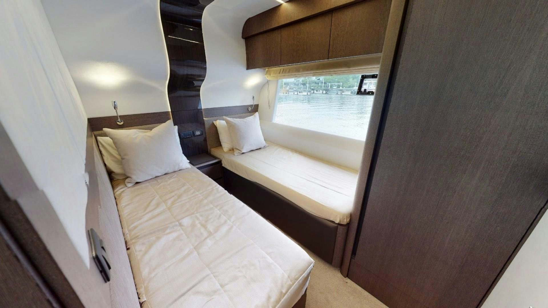 a room with two beds aboard HANG TIME Yacht for Sale