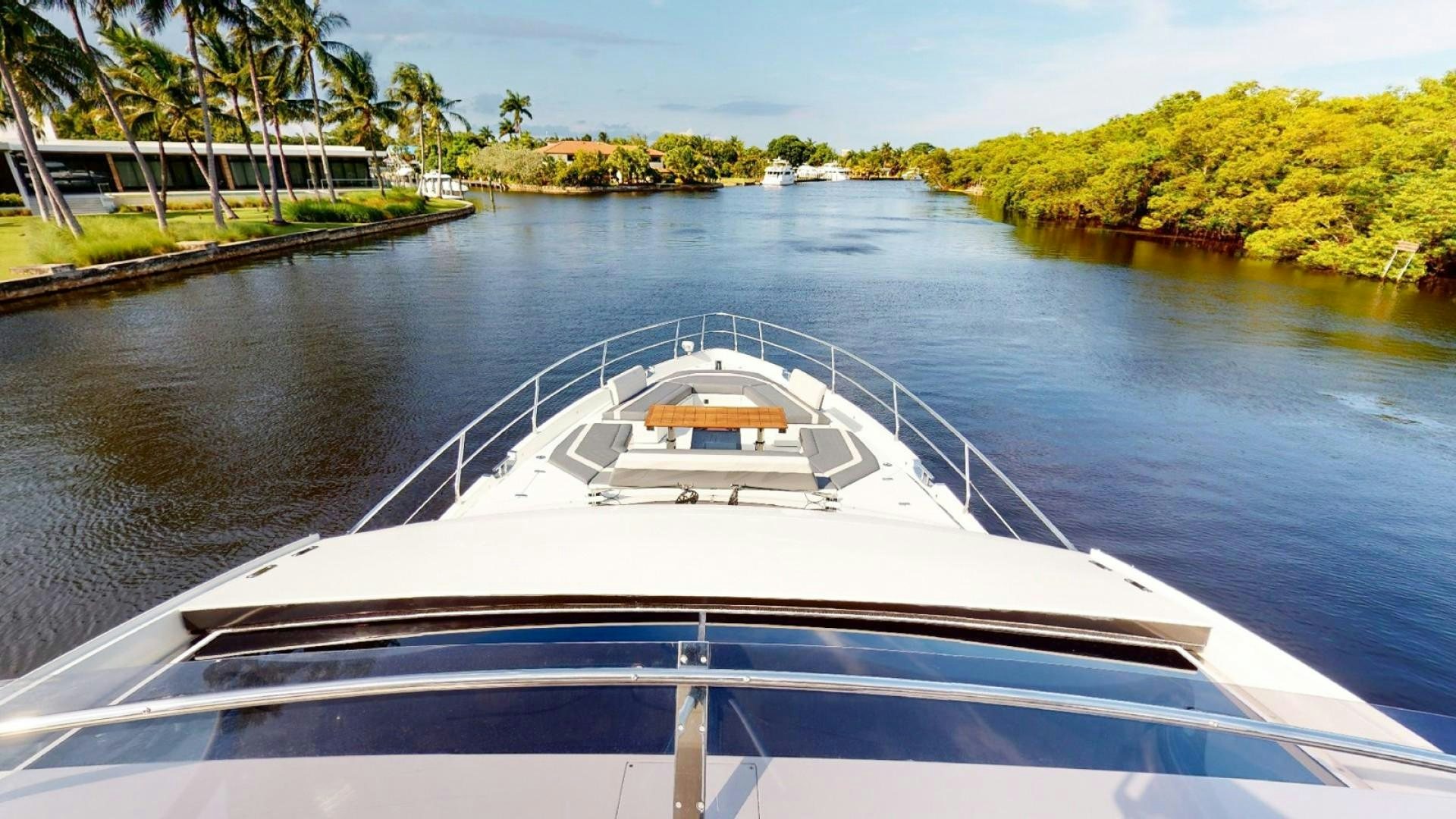 a white boat on water aboard HANG TIME Yacht for Sale