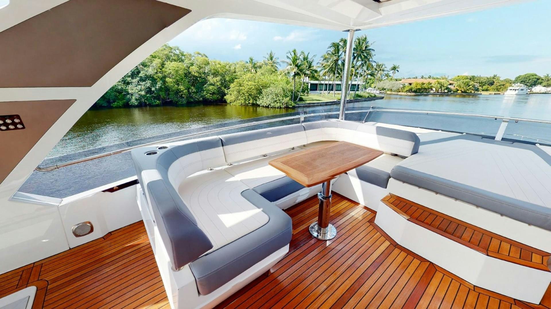 a room with a table and chairs aboard HANG TIME Yacht for Sale