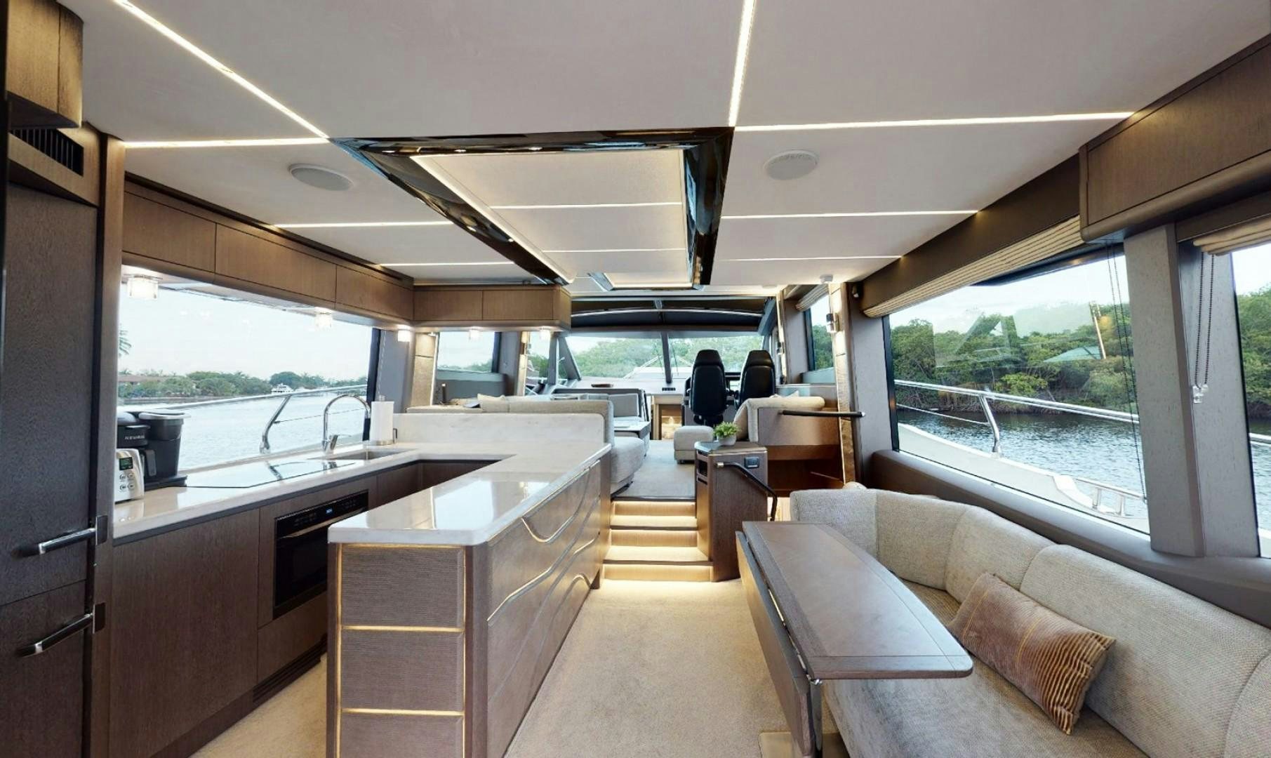 a large open kitchen and living room aboard HANG TIME Yacht for Sale