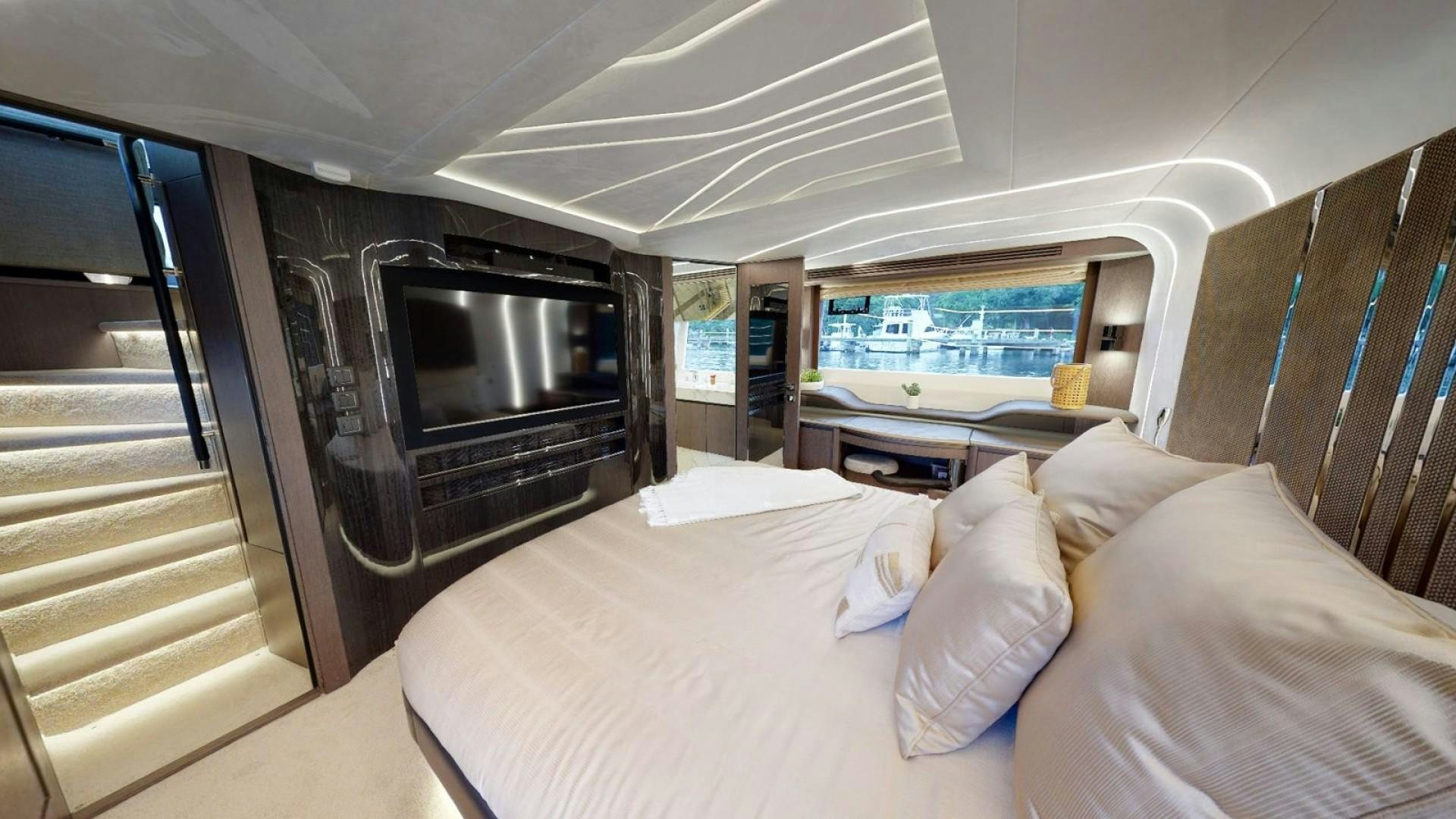 a room with a bed and a microwave aboard HANG TIME Yacht for Sale