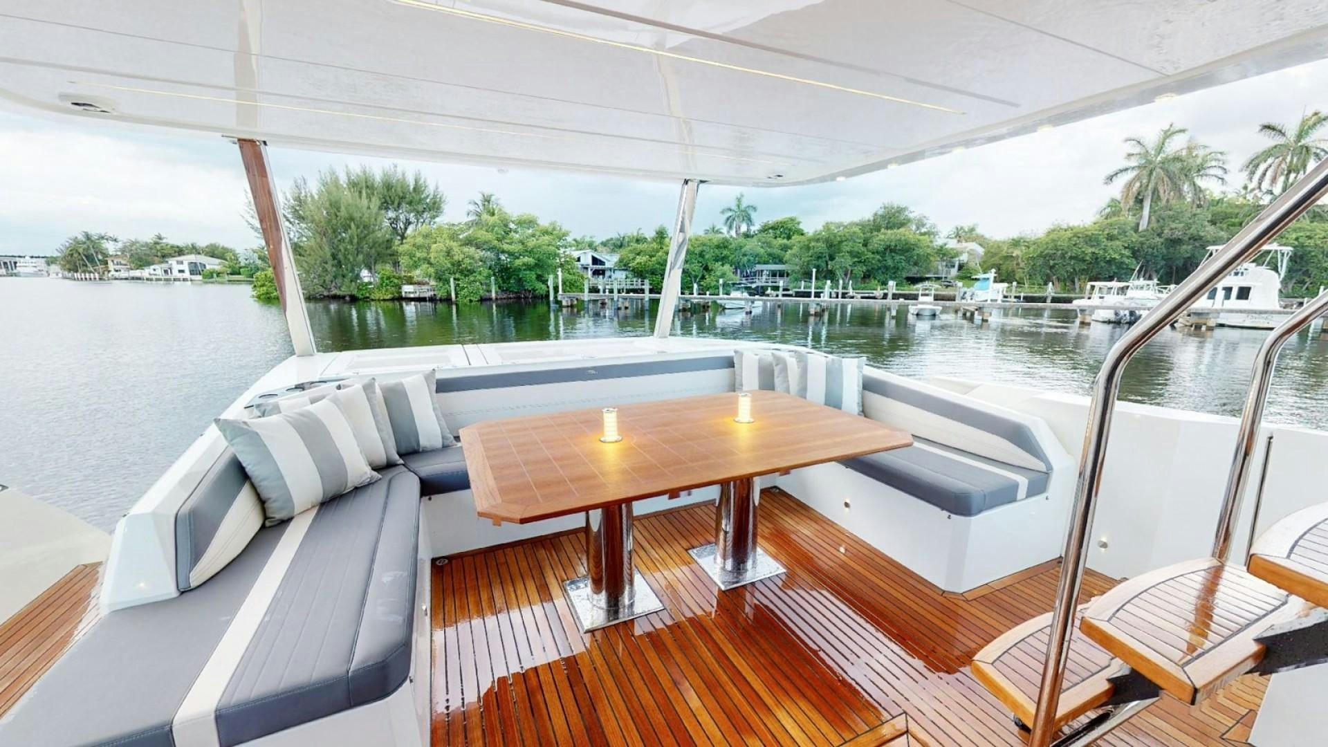 a table and chairs on a boat aboard HANG TIME Yacht for Sale