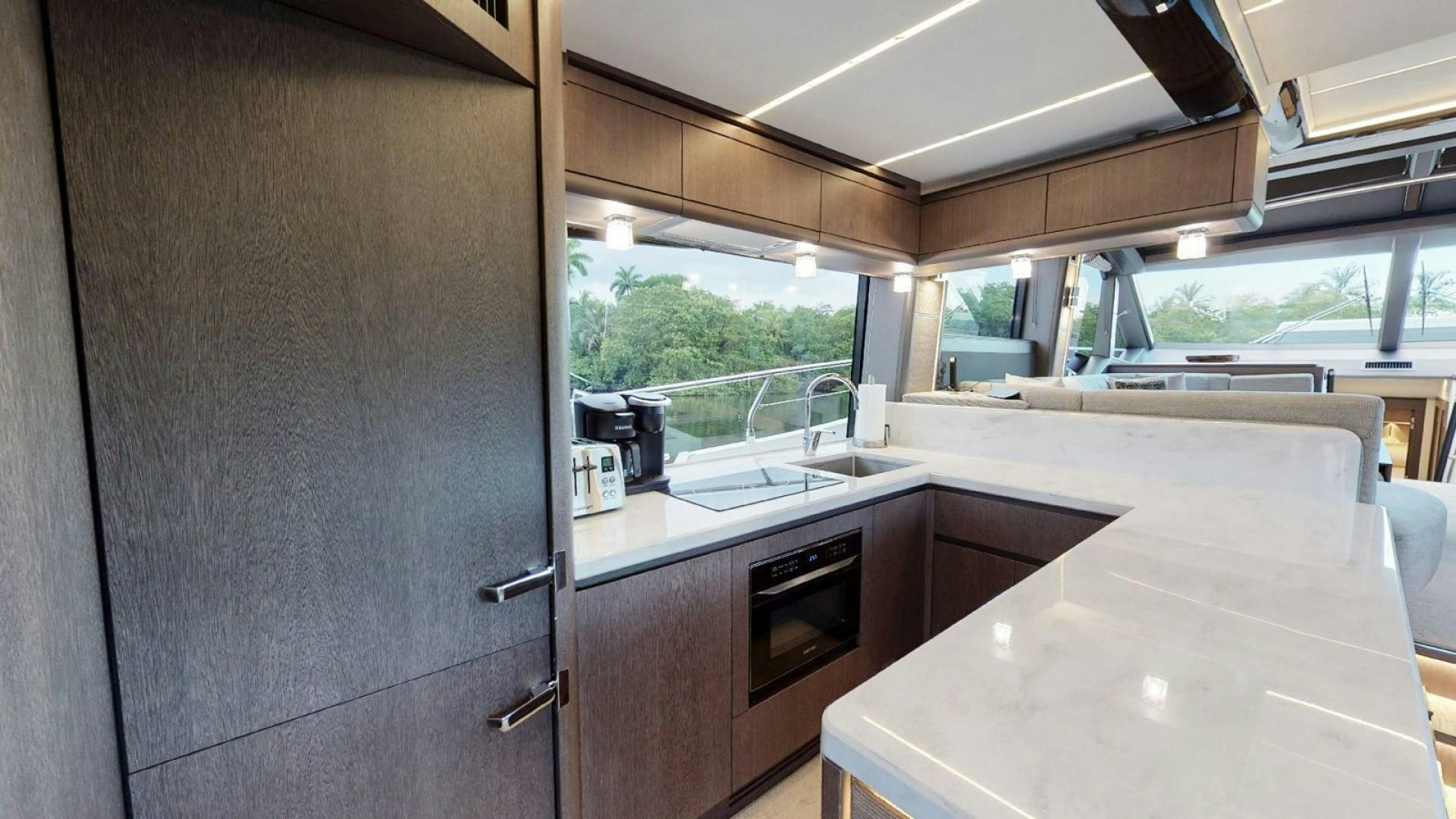 a kitchen with a sink and cabinets aboard HANG TIME Yacht for Sale