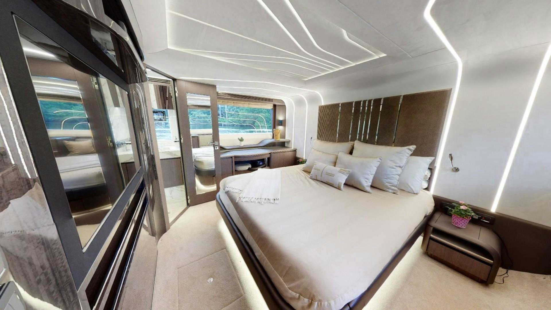 a room with a bed and a window aboard HANG TIME Yacht for Sale