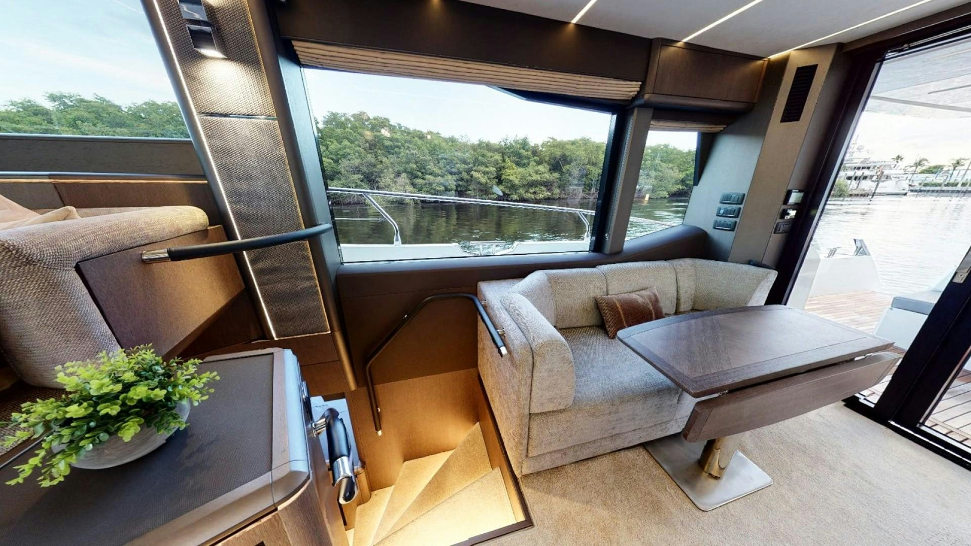 a living room with a couch and a table aboard HANG TIME Yacht for Sale