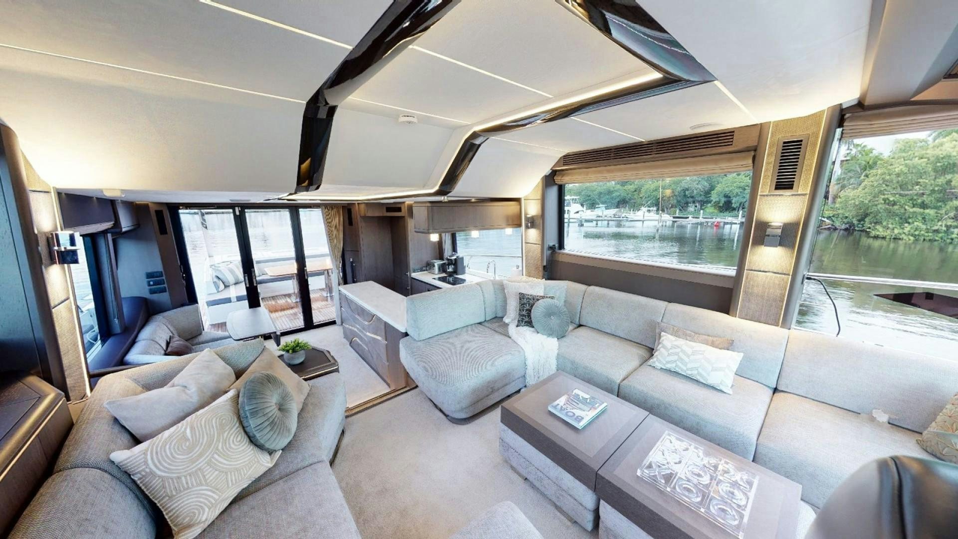 a living room with a large window aboard HANG TIME Yacht for Sale