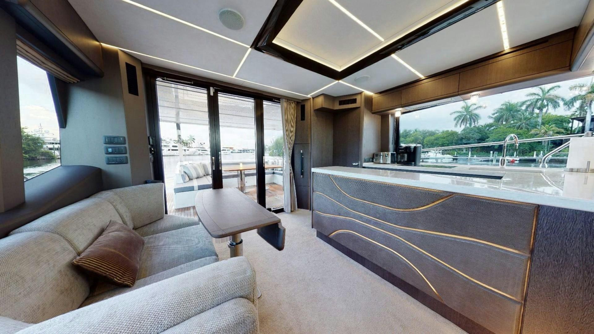 a room with a couch and a pool table aboard HANG TIME Yacht for Sale