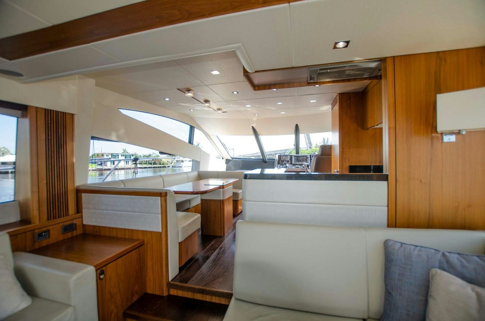a room with a view of the water and the deck aboard No Name Yacht for Sale