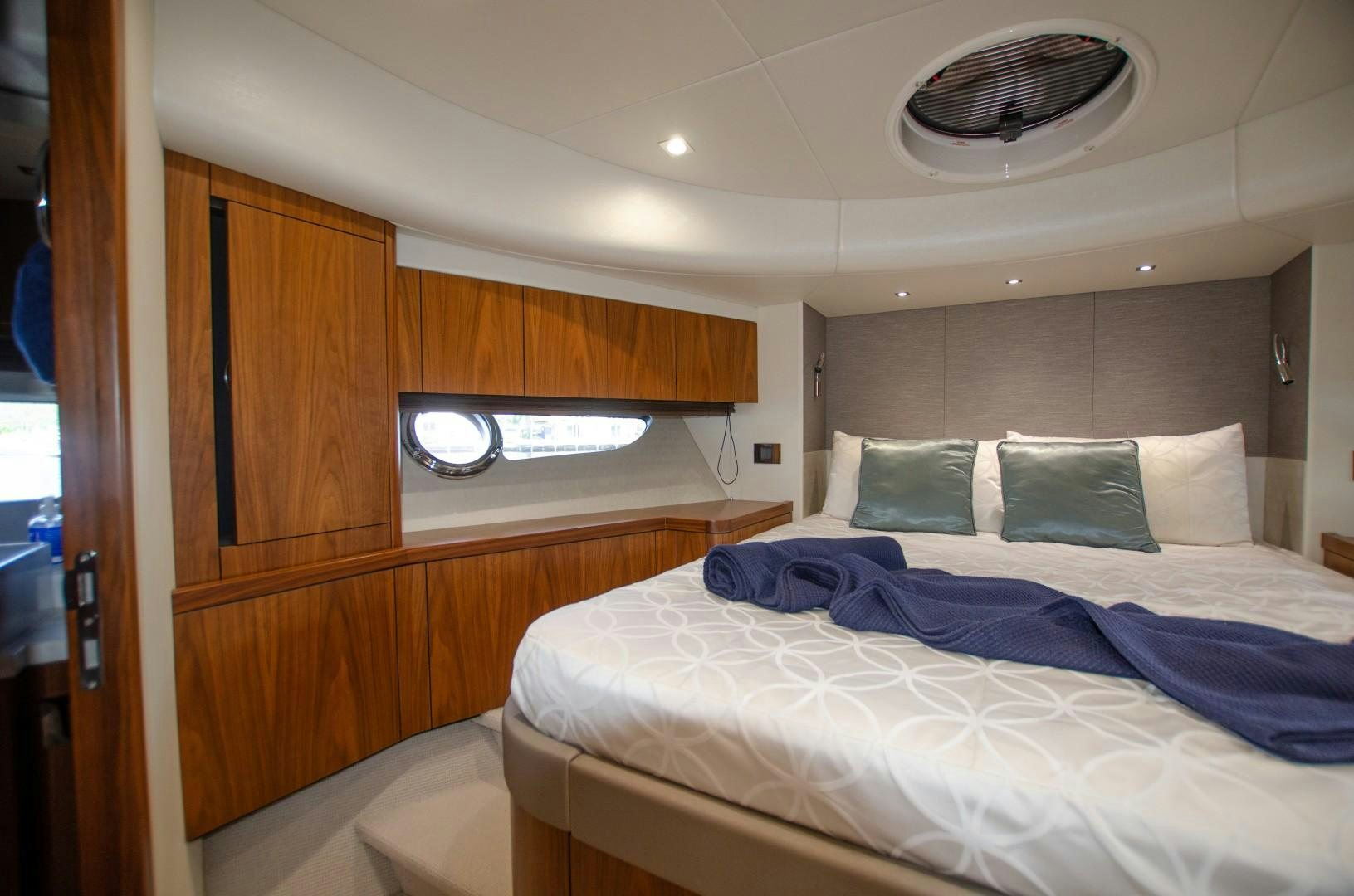 a room with a bed and a mirror aboard No Name Yacht for Sale