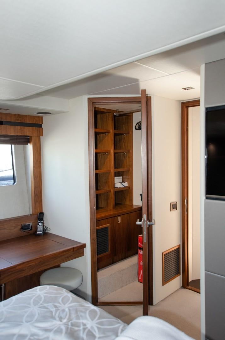 a room with a bed and a closet aboard No Name Yacht for Sale