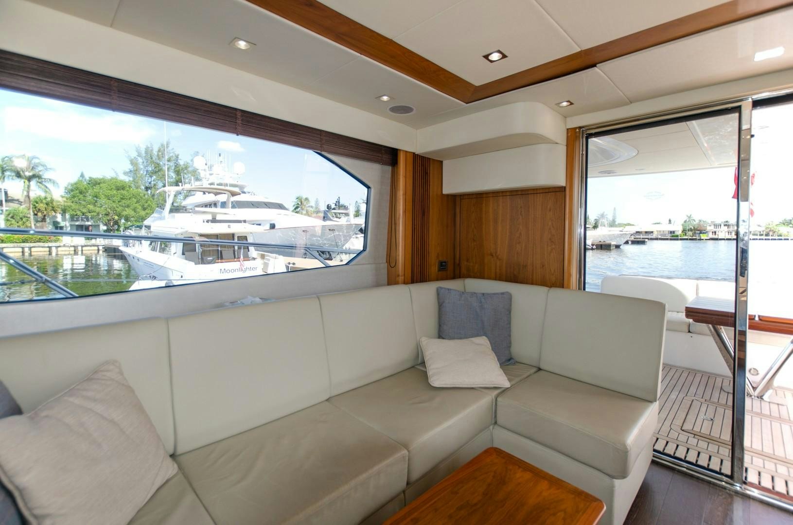 a living room with a large window aboard No Name Yacht for Sale