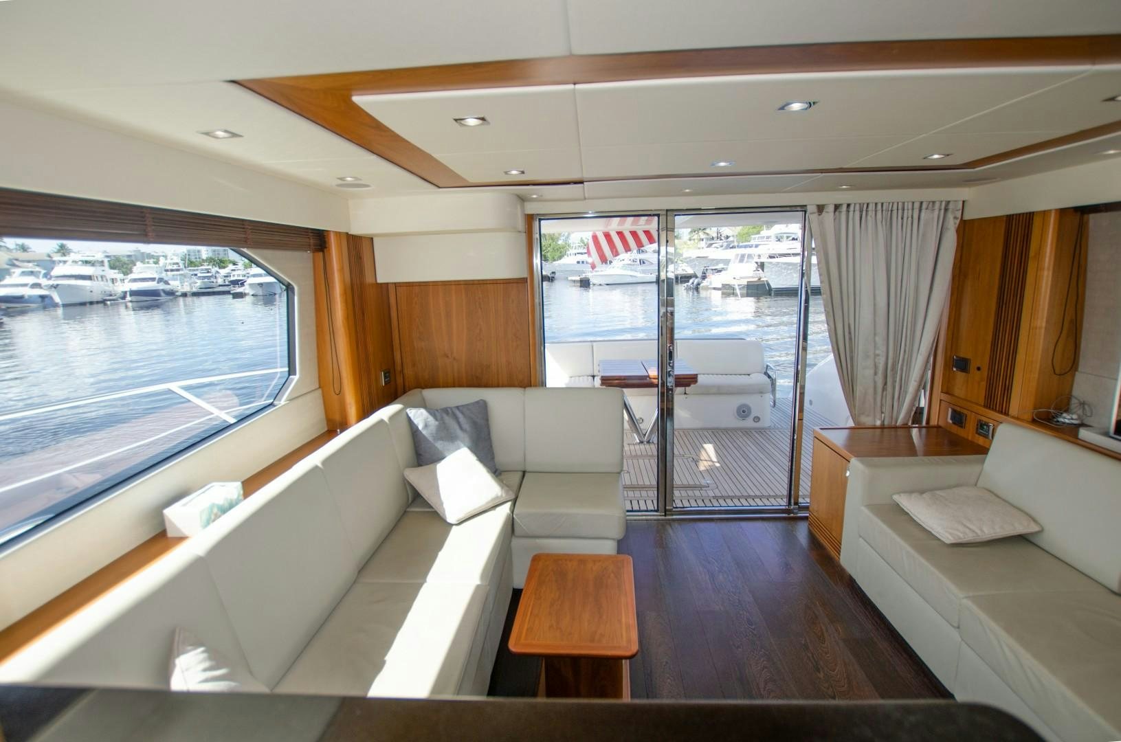 a living room with a view of the city aboard No Name Yacht for Sale