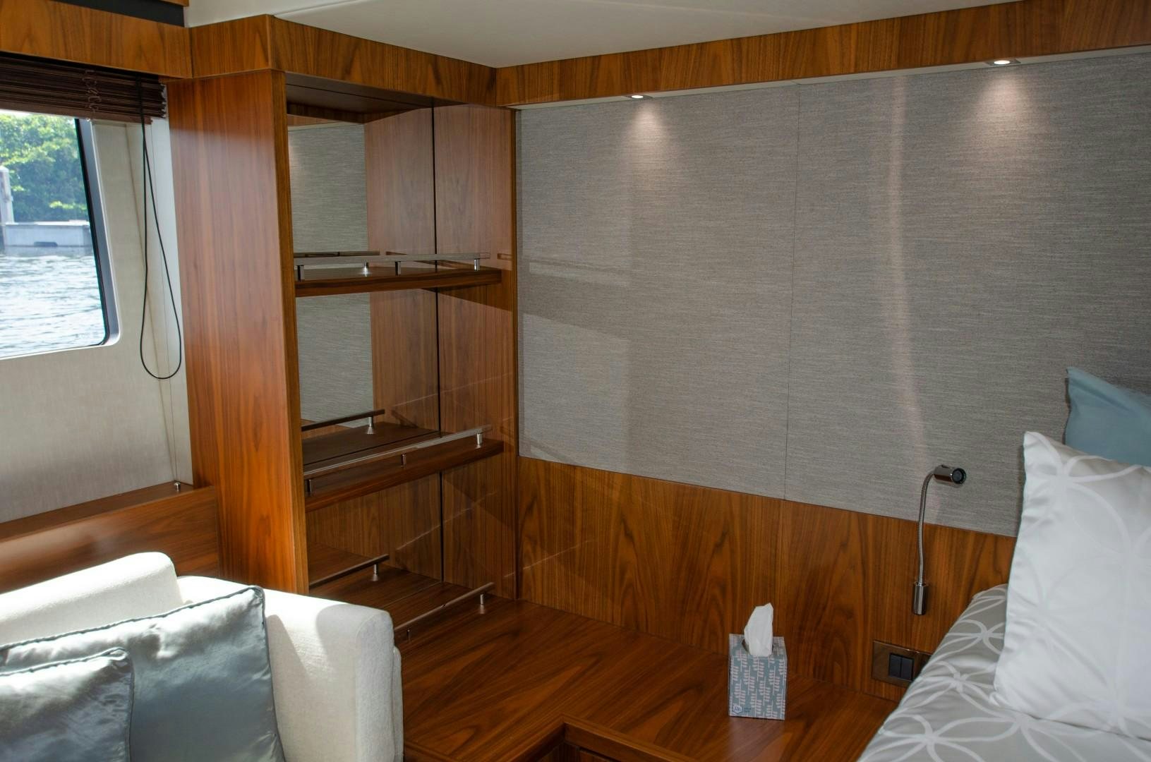 a room with a bed and a shelf aboard No Name Yacht for Sale
