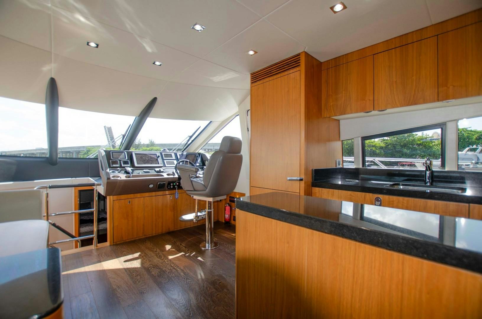 a room with a desk and chairs aboard No Name Yacht for Sale
