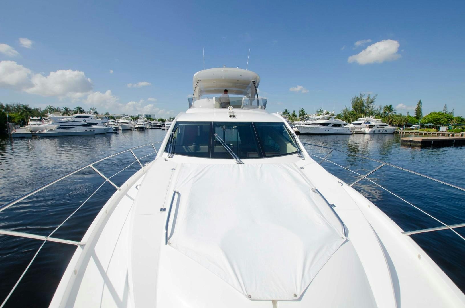 a white boat in a harbor aboard No Name Yacht for Sale