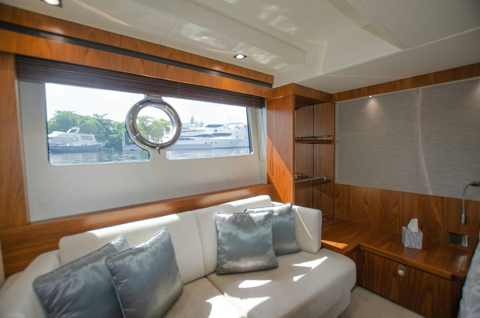 a room with a couch and a window aboard No Name Yacht for Sale
