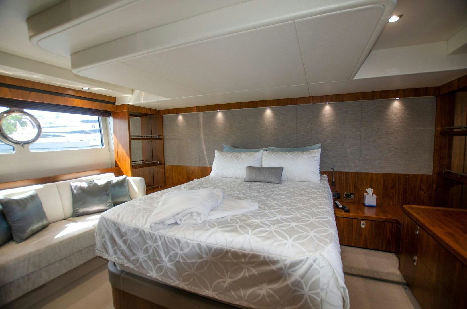 a room with a bed and a window aboard No Name Yacht for Sale