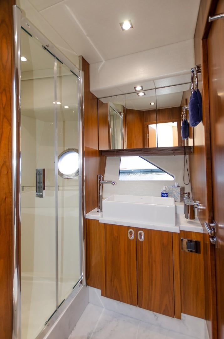 a bathroom with a shower unit and sink aboard No Name Yacht for Sale