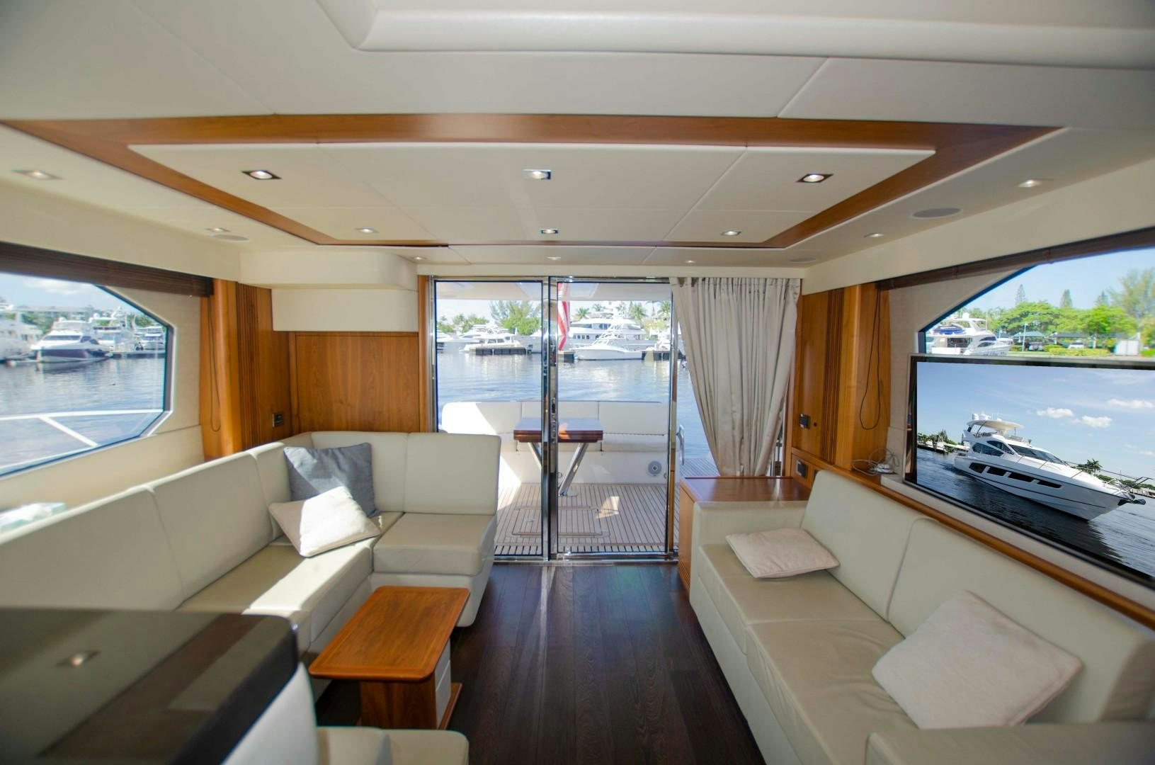 a living room with a large glass door aboard No Name Yacht for Sale