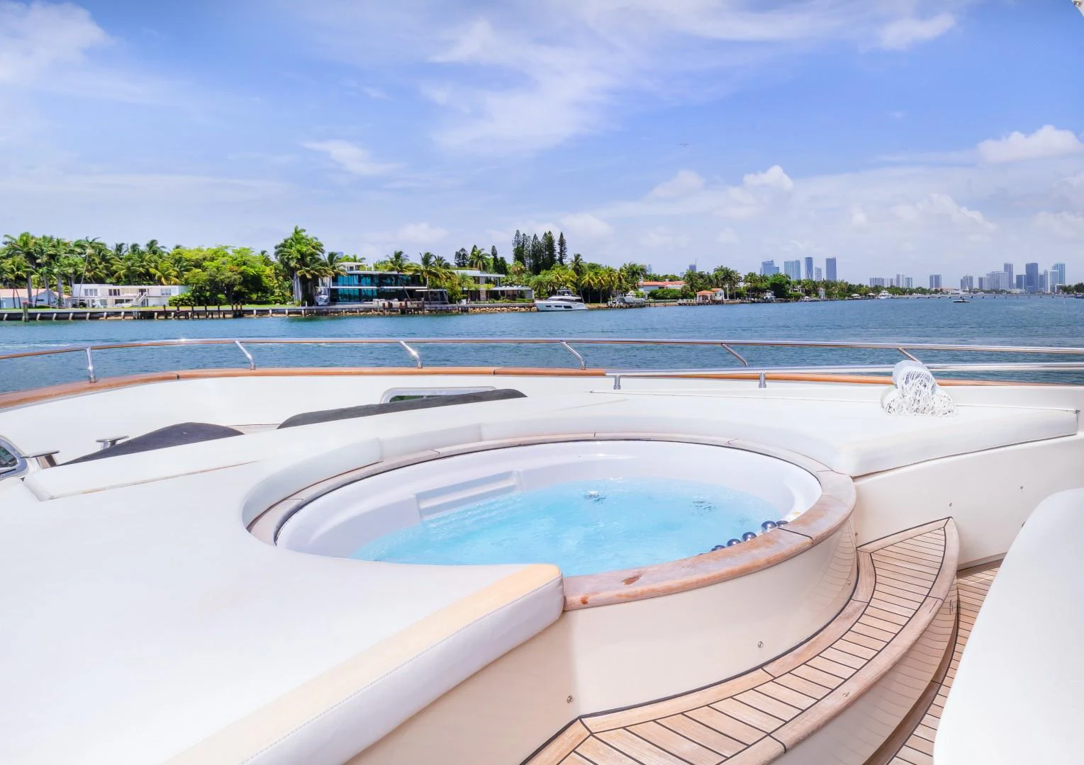 a pool on a deck overlooking a beach aboard CASUAL Yacht for Sale