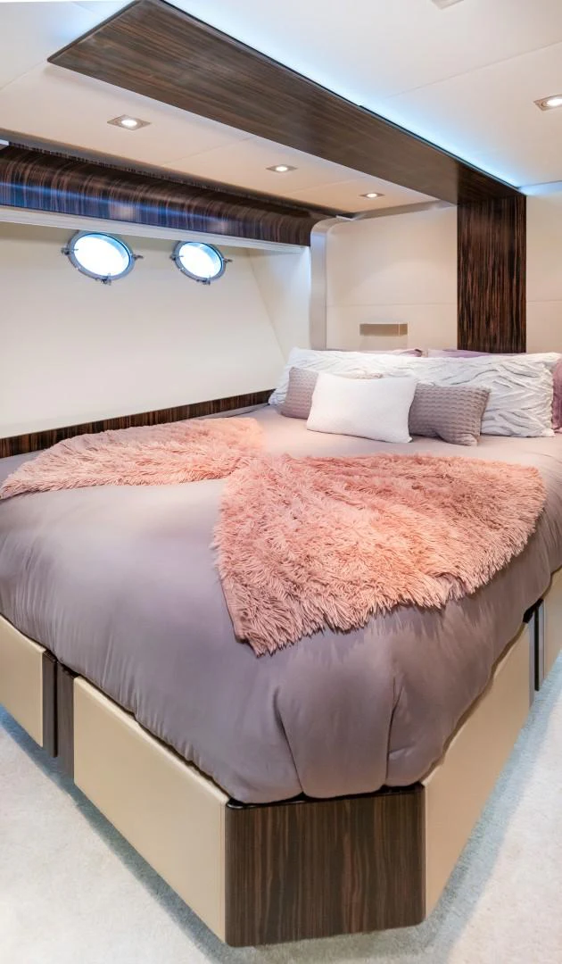 a bed with a pink blanket aboard CASUAL Yacht for Sale