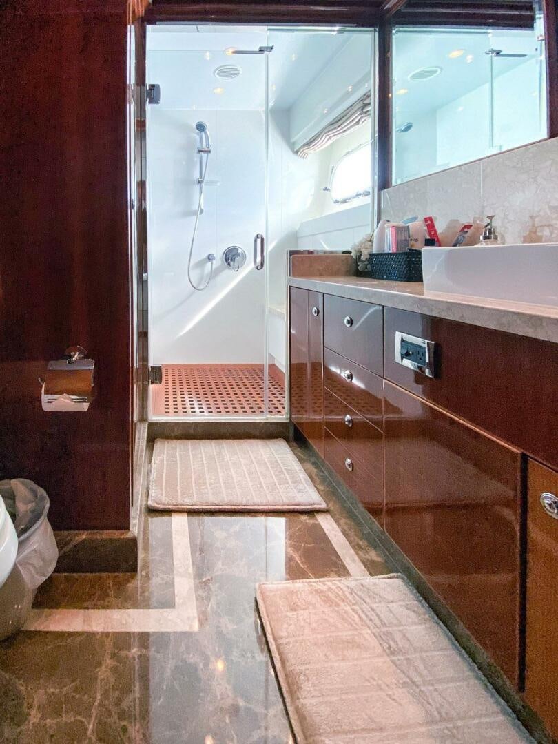 a bathroom with a sink and a mirror aboard CYNDERELLA Yacht for Sale