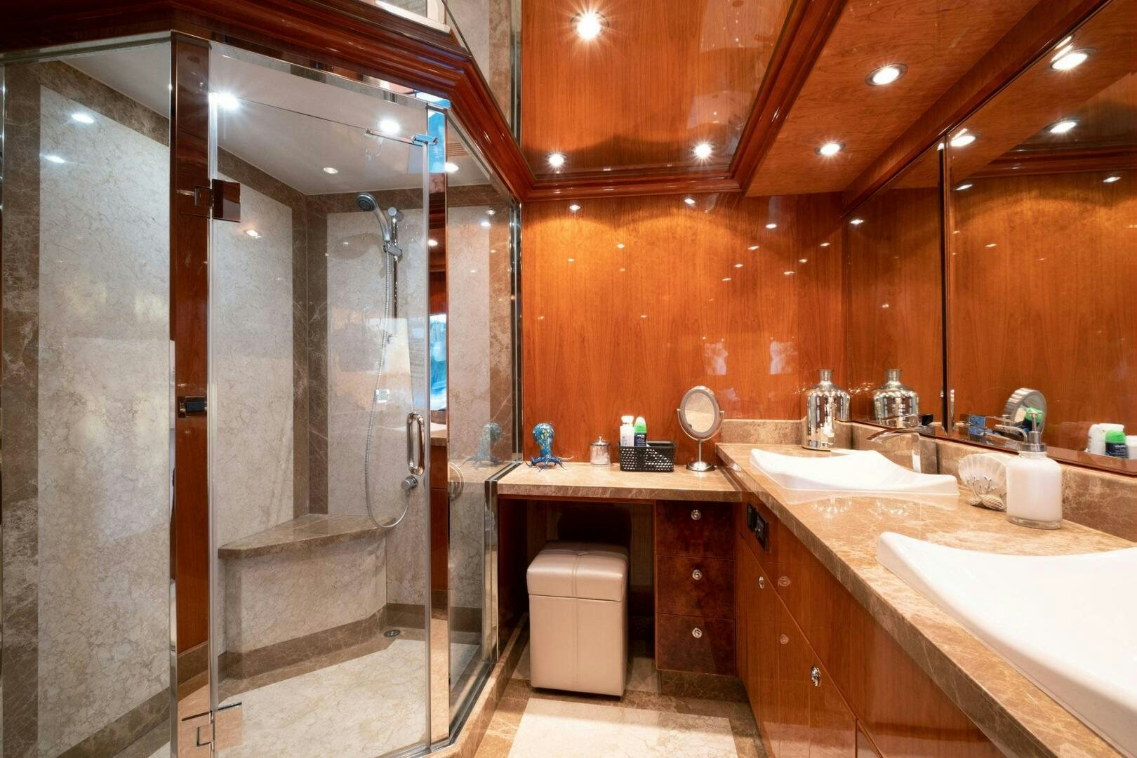 a bathroom with a shower and sink aboard CYNDERELLA Yacht for Sale