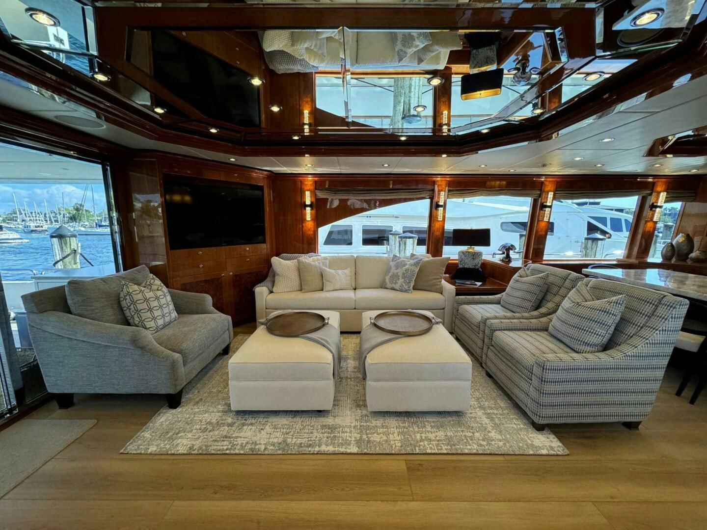 a living room with a large window aboard CYNDERELLA Yacht for Sale