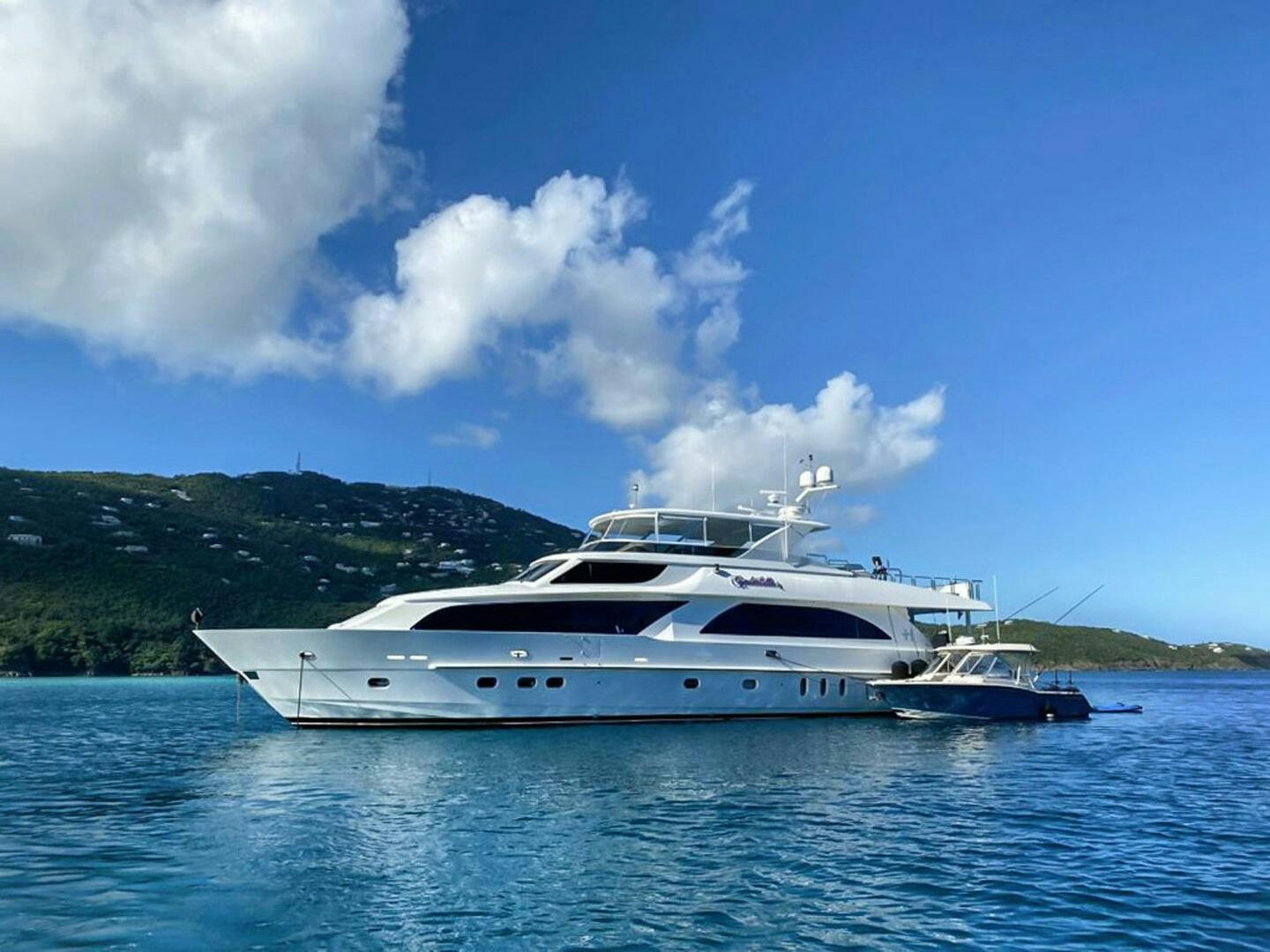 a white yacht in the water aboard CYNDERELLA Yacht for Sale