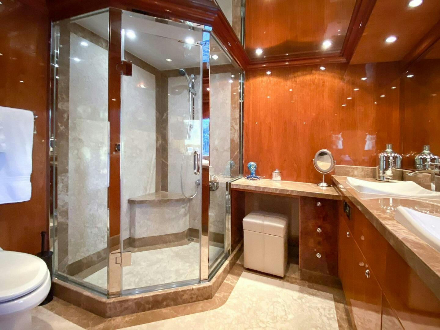 a bathroom with a shower and sink aboard CYNDERELLA Yacht for Sale
