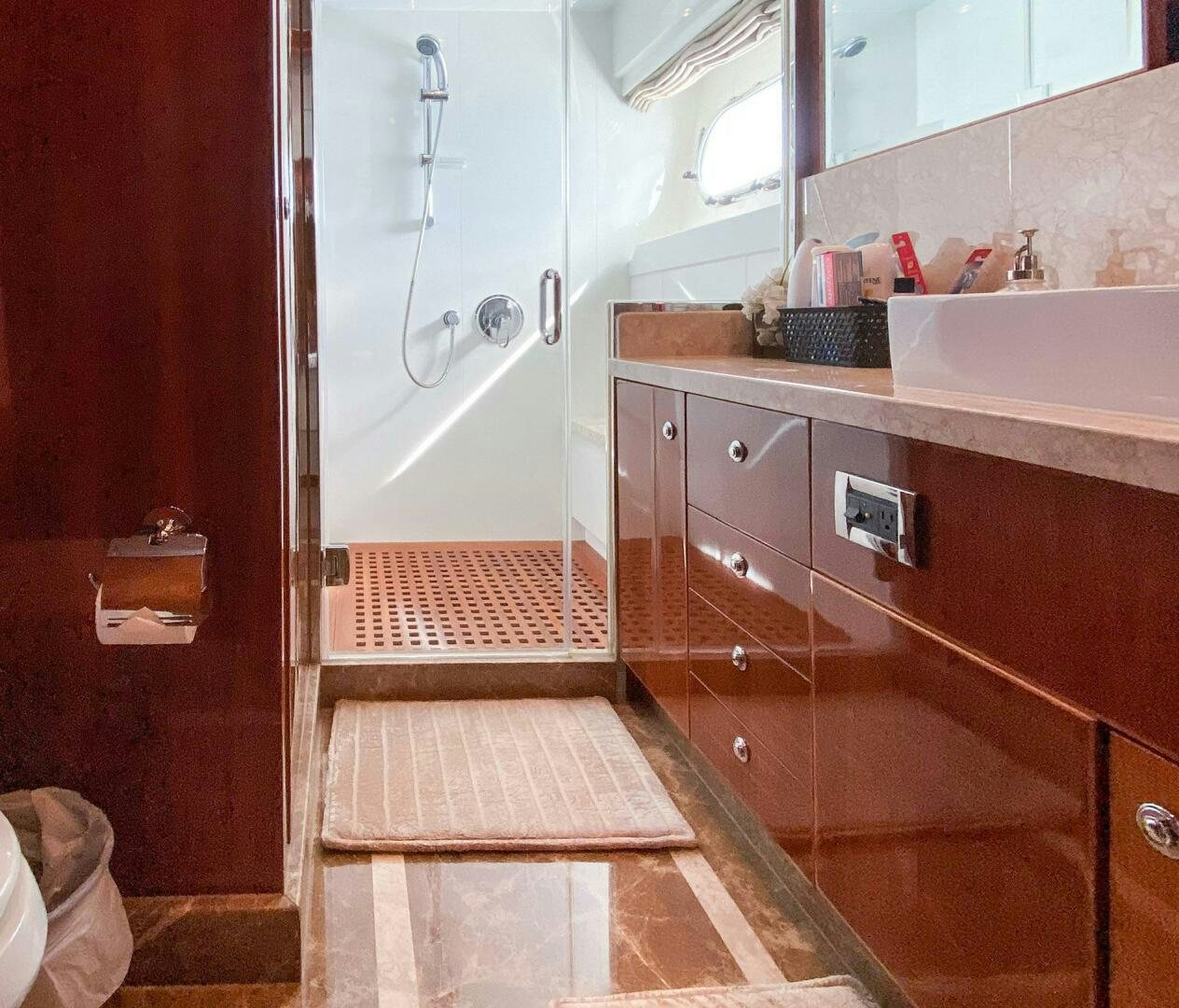 a bathroom with a sink and a mirror aboard CYNDERELLA Yacht for Sale