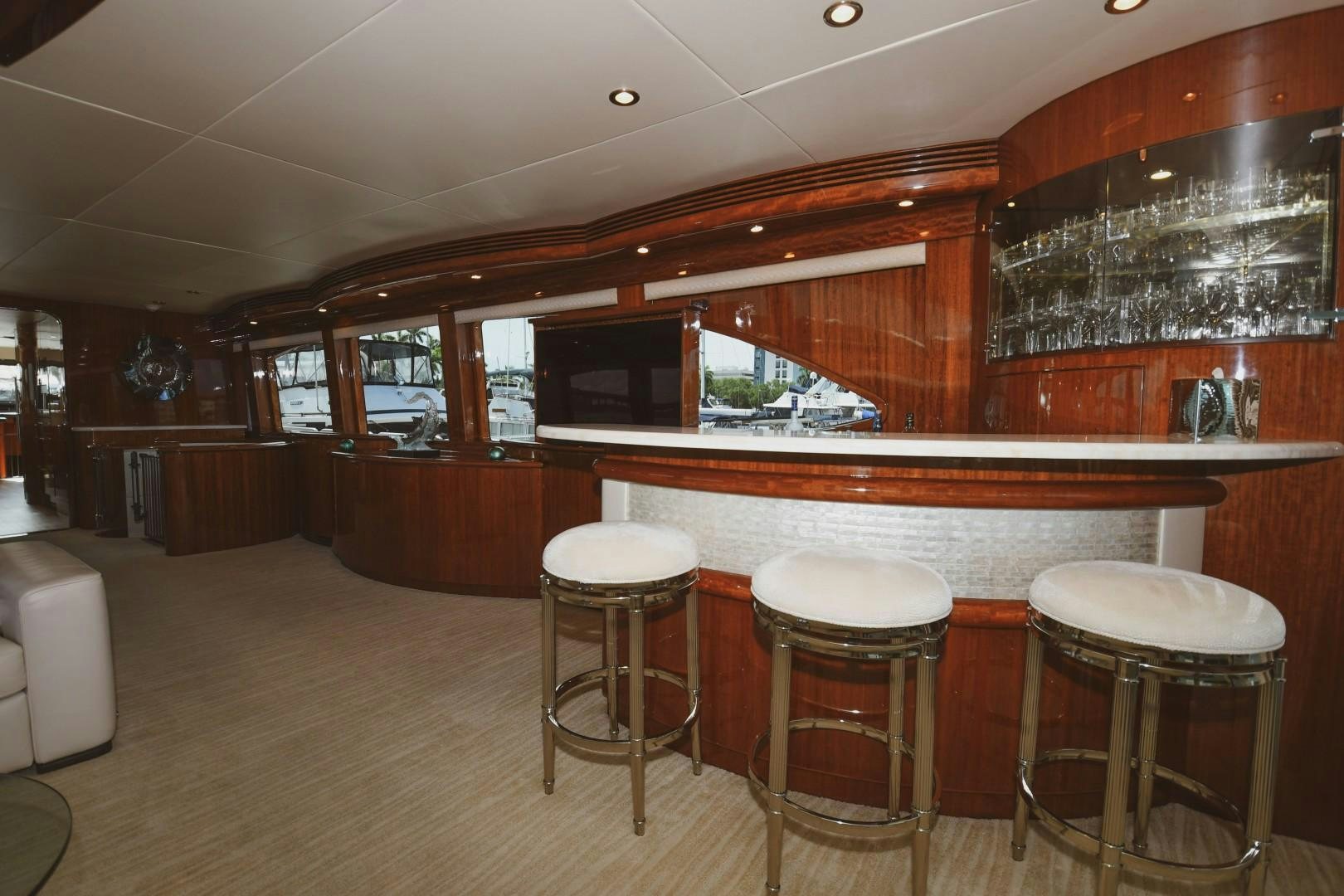 a bar with stools and stools aboard WARHORSE Yacht for Sale