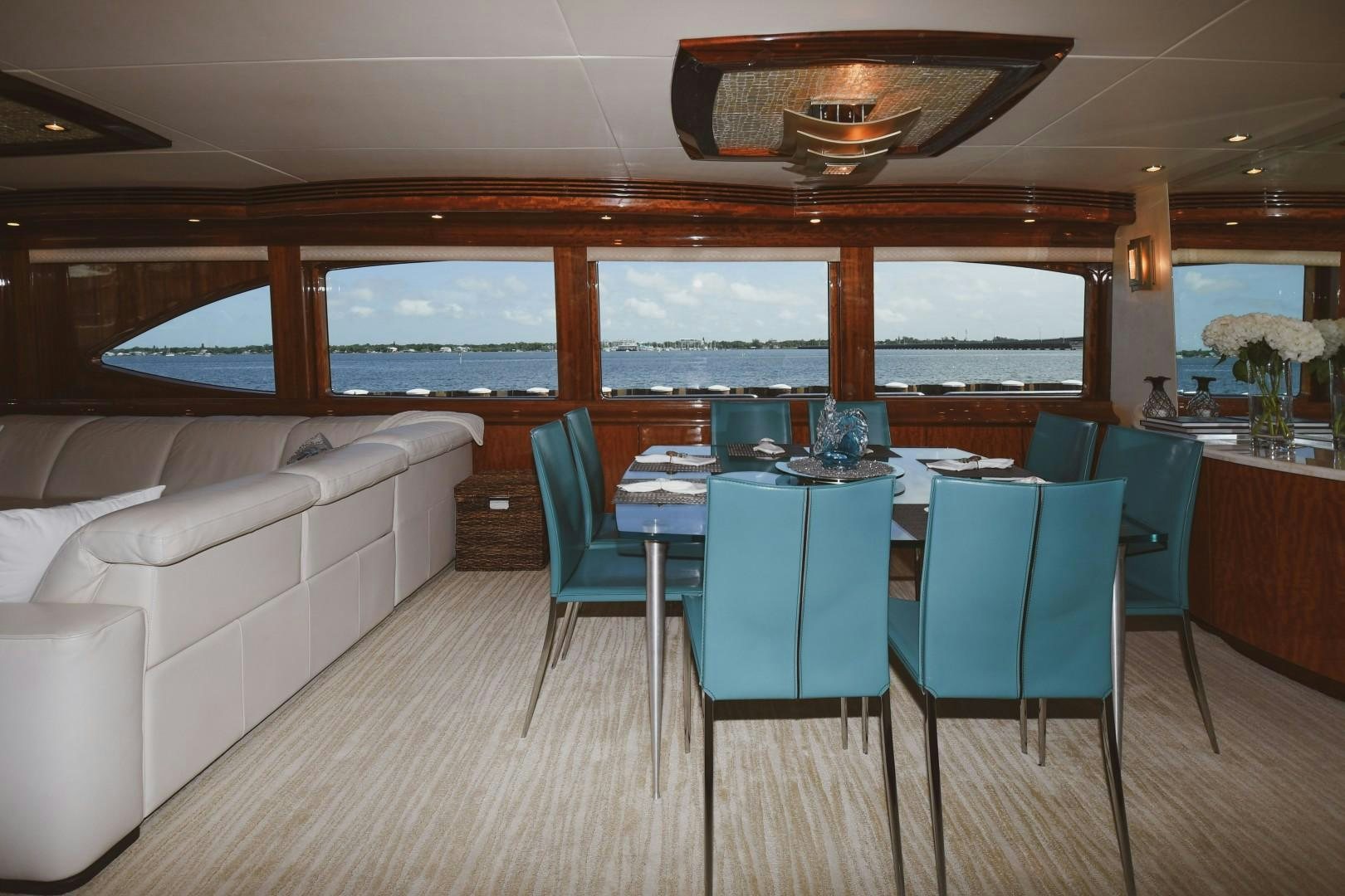 a room with a table and chairs aboard WARHORSE Yacht for Sale