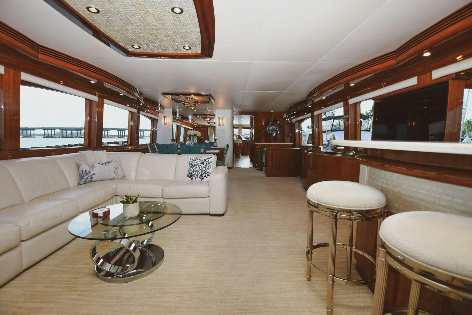 a living room with a couch and a table aboard WARHORSE Yacht for Sale