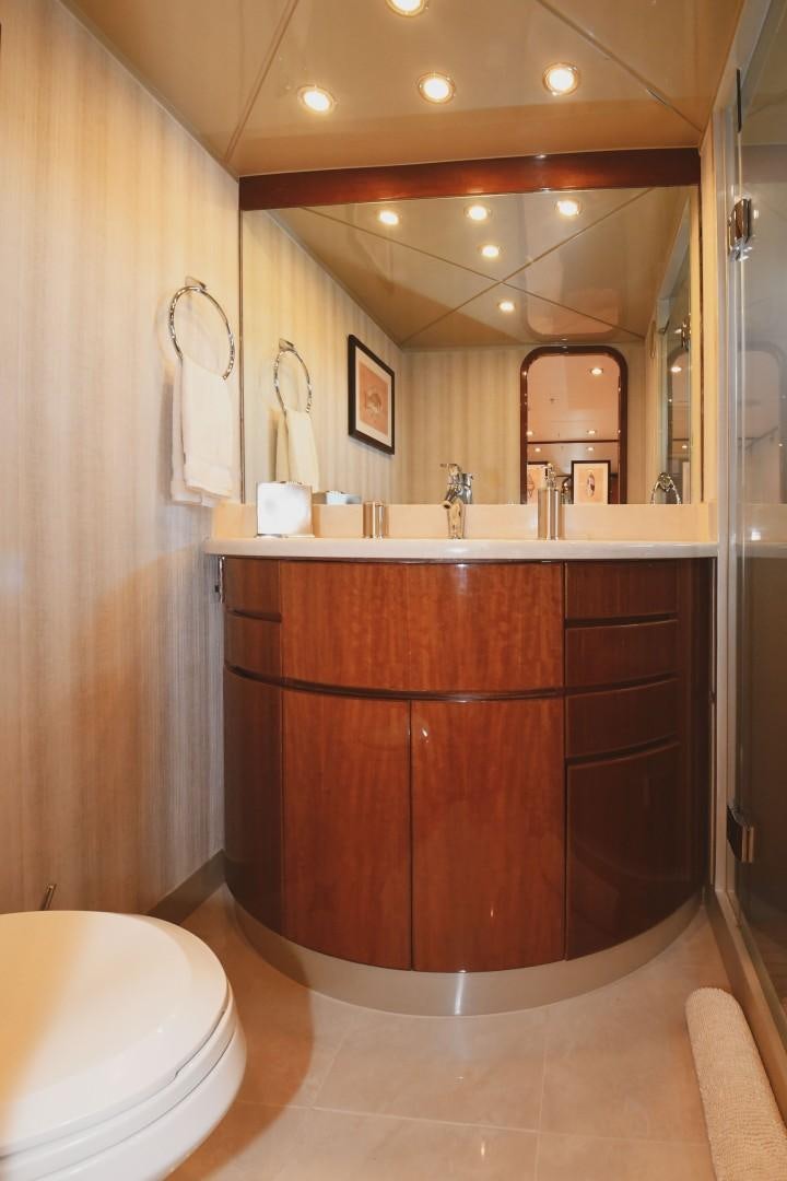 a bathroom with a large mirror aboard WARHORSE Yacht for Sale