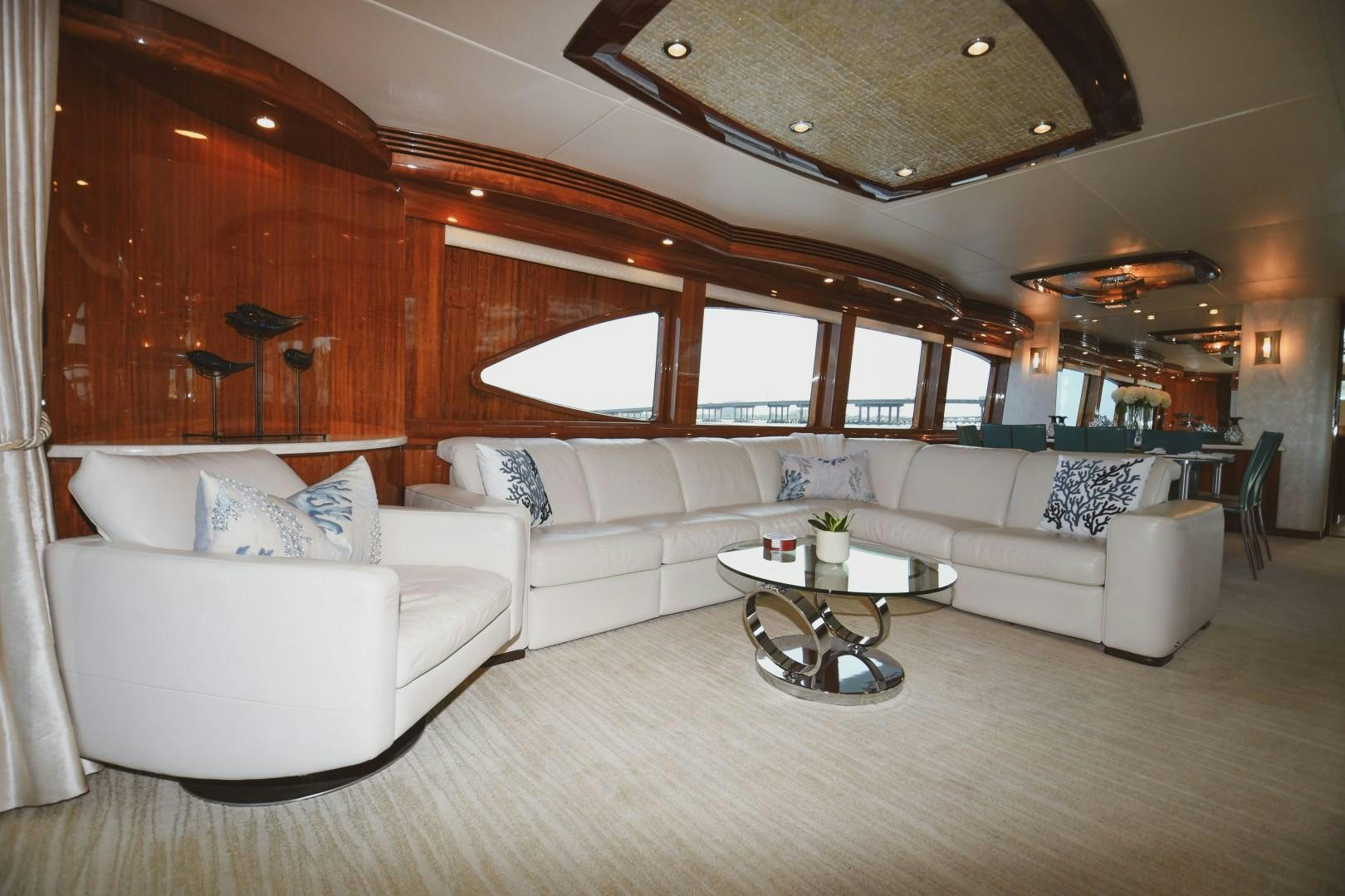 a living room with a couch and a table aboard WARHORSE Yacht for Sale